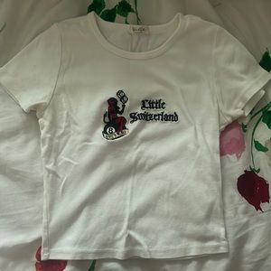 White “little Switzerland” baby tee